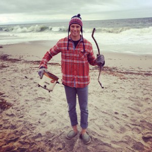 Surfrider volunteer Phil Chowaniec holds two of the more unusual items collected at a Moran Lake Beach cleanup: a crock pot and bicycle handlebar.